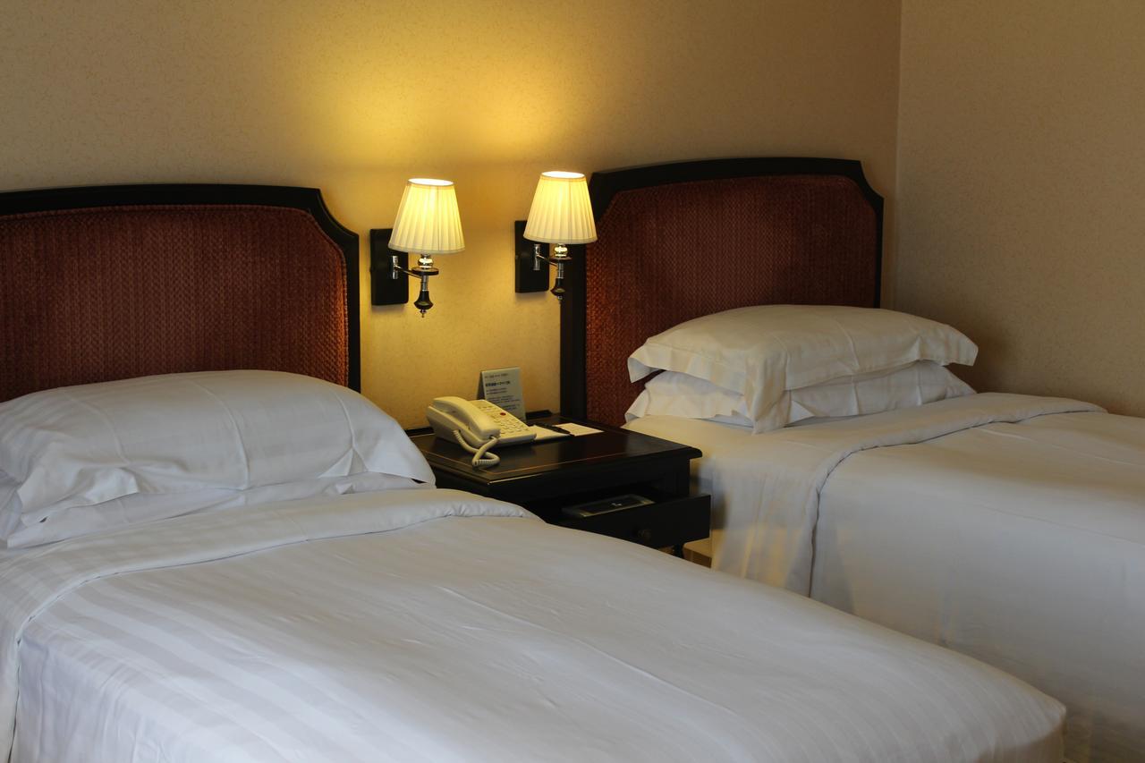 Hotel Kingdom Kaohsiung Quarto foto